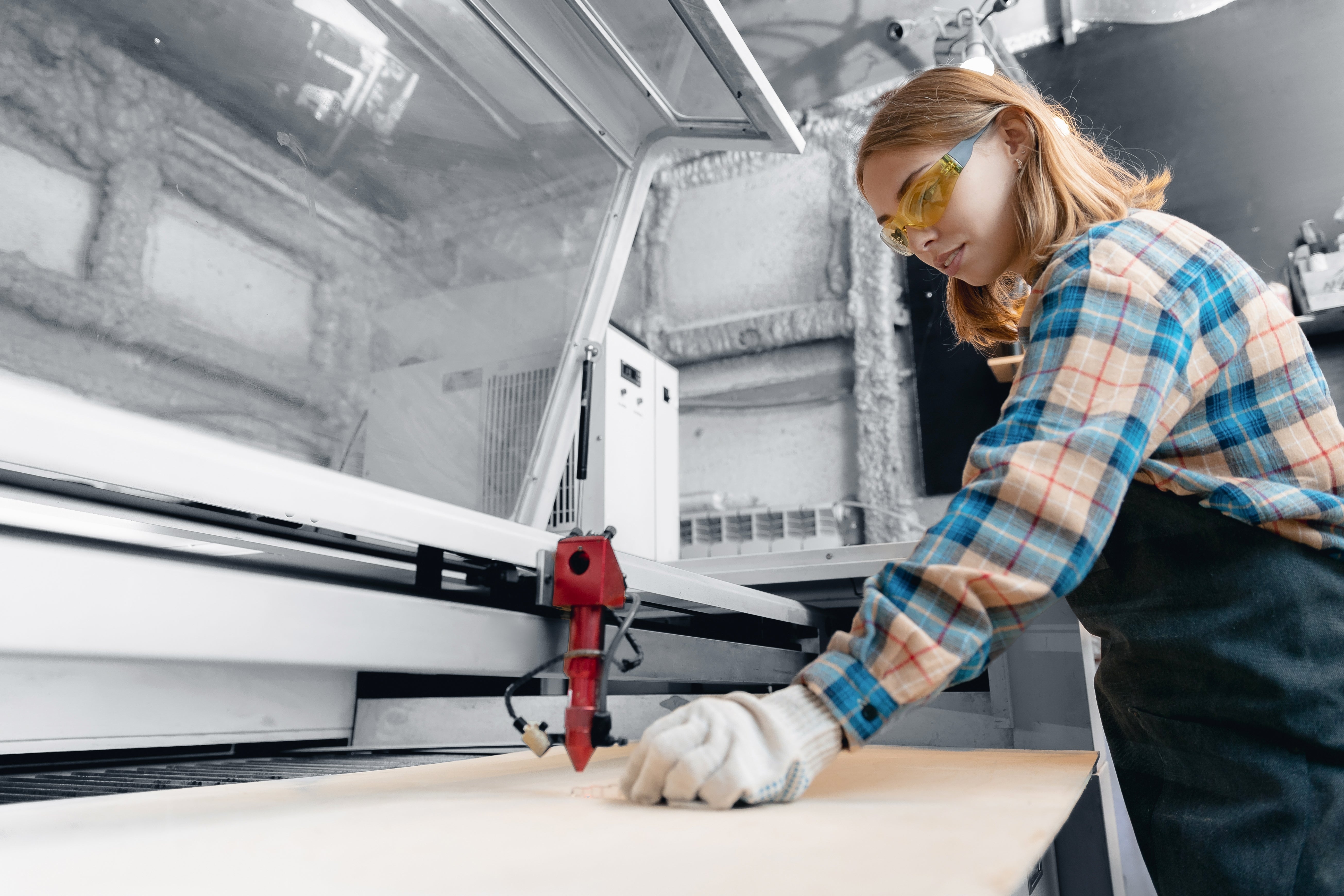 Lasersheets industrial worker loading sheet in laser machine